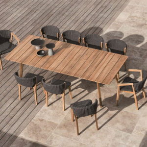 Ethimo's Knit range XL dining table with dining chairs in use.