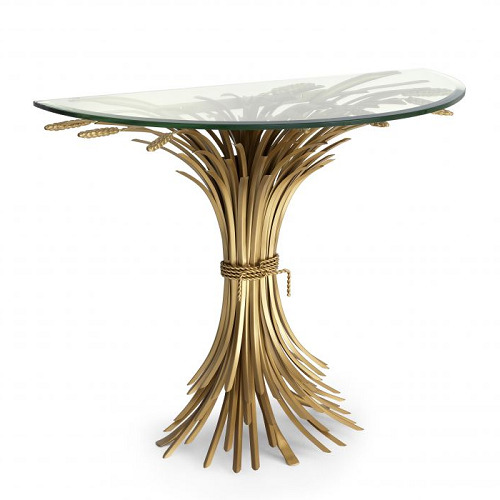 Luxurious Console Table Bonheur by Eichholtz in painted brass colour with bevelled clear glass top. Sheaf-shaped base
