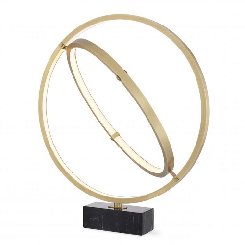 Table Lamp Cassini by Eichholtz galactic rings in antique brass finish with a black marble base. Dimmable integrated LED lights
