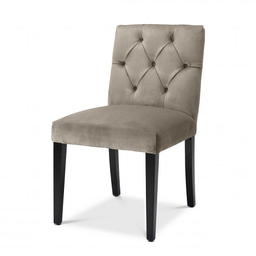 Luxurious Dining Chair Atena in savona greige velvet with black legs. Features classic buttoned back