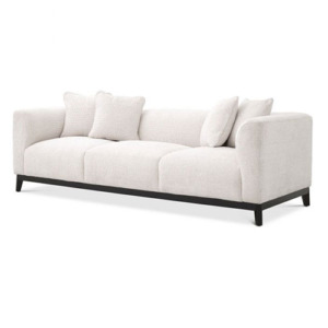 Designer luxurious Sofa Corso by Eichholtz available in lyssa sand and lyssa off-white fabric with a black base finish. Includes 4 x scatter cushions