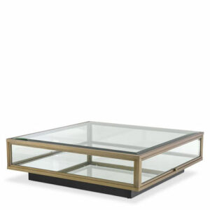 Designer Coffee Table Ryan by Eichholtz in brushed brass finish with clear glass and mirror glass. Features side glass door and Black base with an integrated shelf of mirror glass