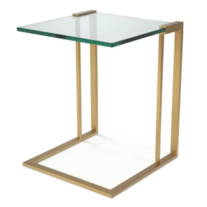 Designer Side Table Perry by Eichholtz in brushed brass finish, bronze finish or polished stainless steel finish. Thick clear glass table-top