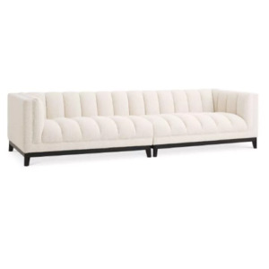 Designer luxurious Sofa Ditmar L by Eichholtz in boucle cream upholstery with a black base. Features deep channel stitching