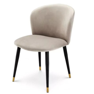 Luxurious Dining Chair Volante by Eichholtz available in roche beige velvet, roche dark green velvet or savona midnight blue velvet, Features tapered black legs with gold finished caps