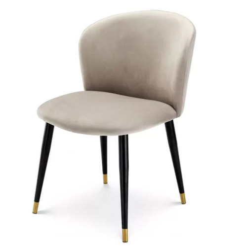 Luxurious Dining Chair Volante by Eichholtz available in roche beige velvet, roche dark green velvet or savona midnight blue velvet, Features tapered black legs with gold finished caps