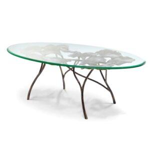 Designer Coffee Table Poseidon by Eichholtz oval in vintage brass with a clear glass table top with leafy decorative detail