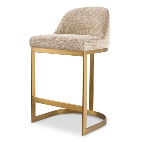 Designer Counter Stool Condos by Eichholtz in lyssa sad upholstery and a brushed brass finish frame
